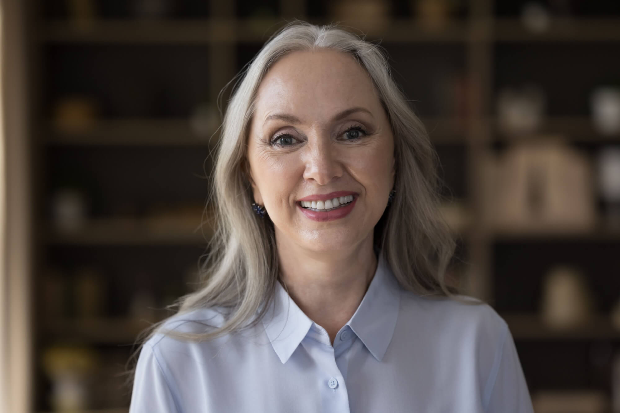 middle-aged attractive woman standing in office