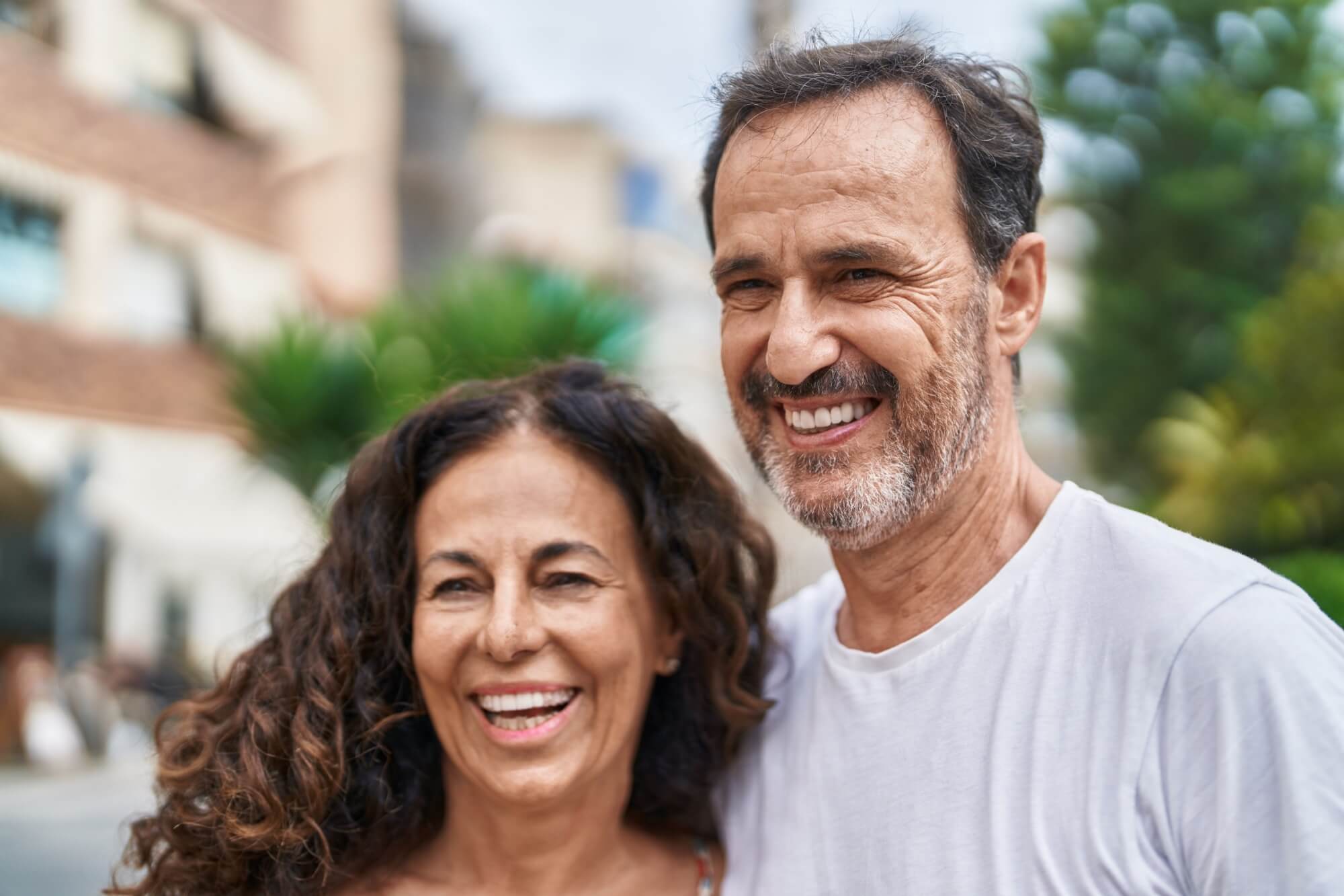 Man and woman couple smiling confident standing together at street