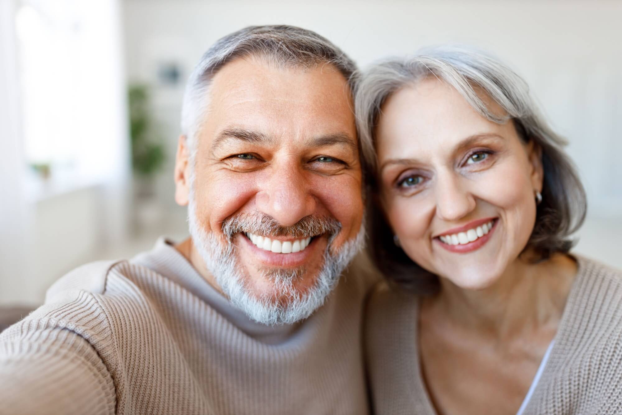 happy beautiful senior couple smiling
