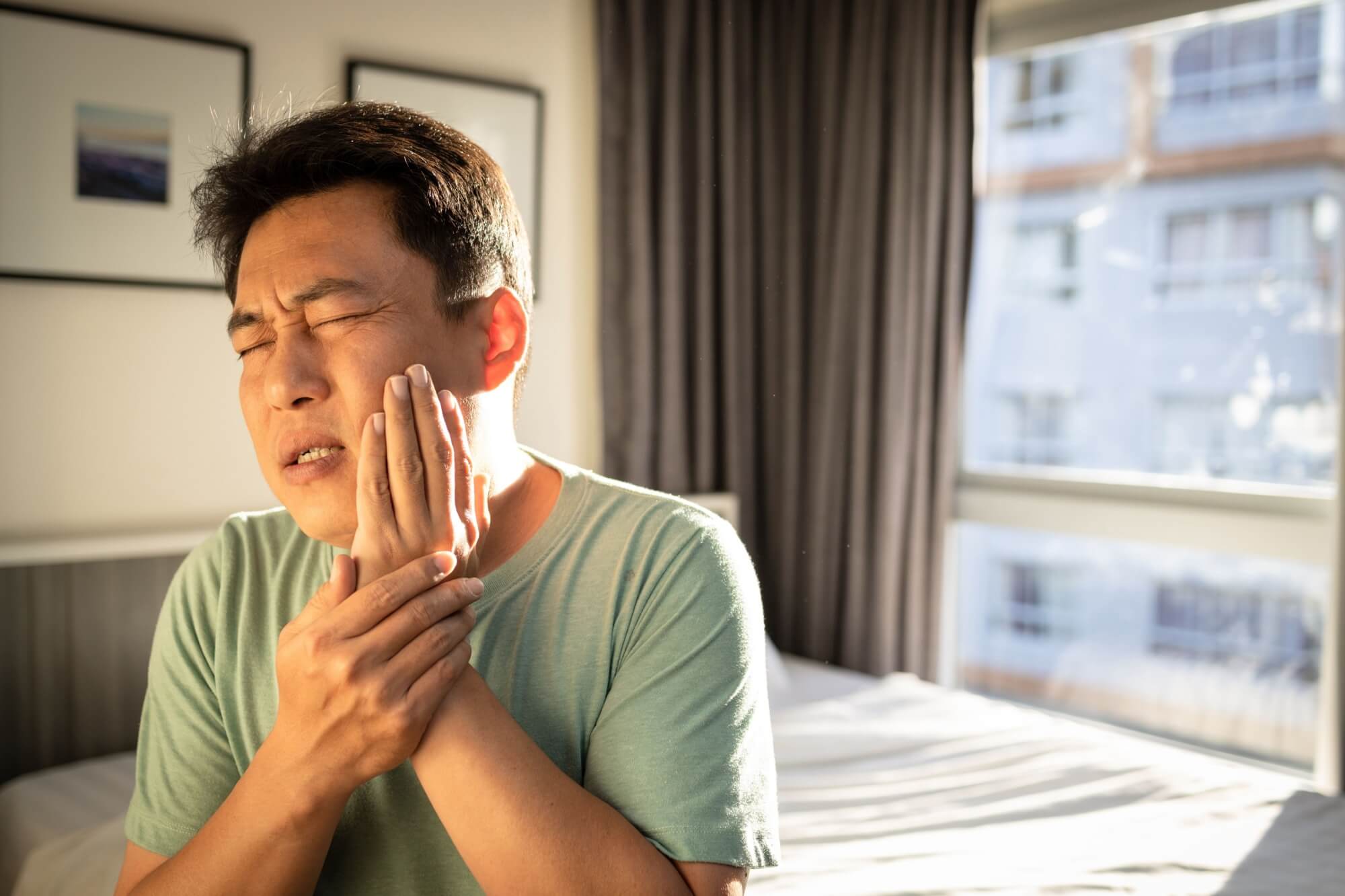 Middle aged man suffering from toothache