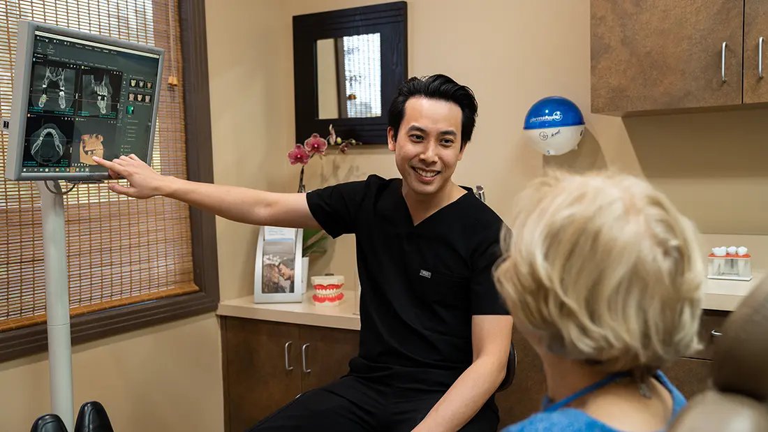 Dr. Clarence Lee with patient