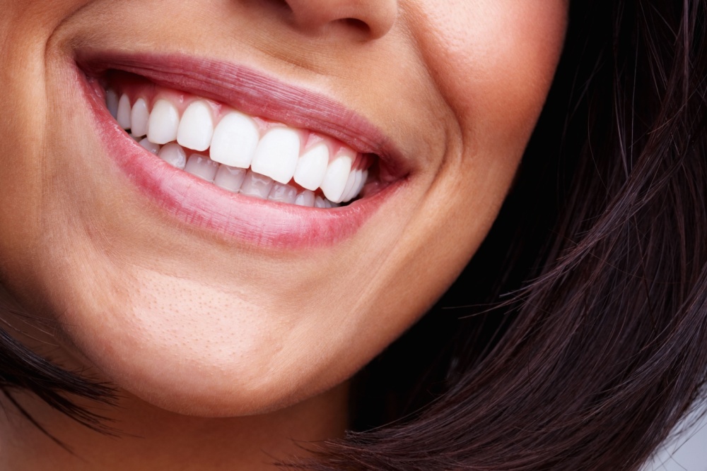Happy female person with toothy smile