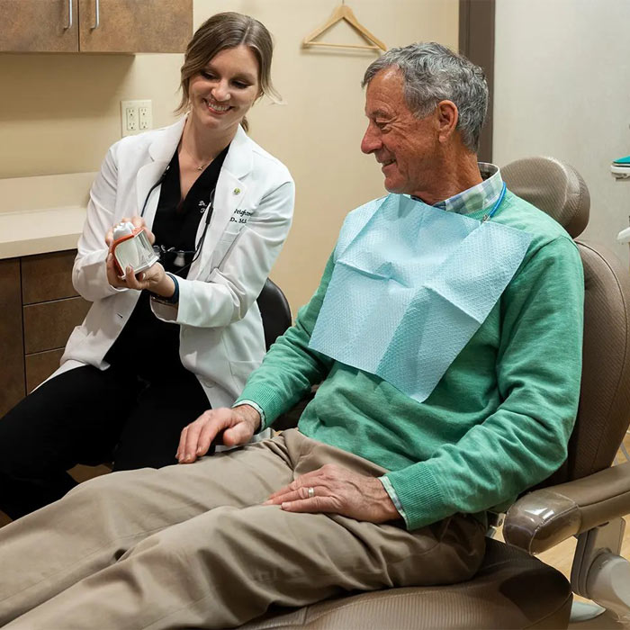Female Dentist and patient consulting