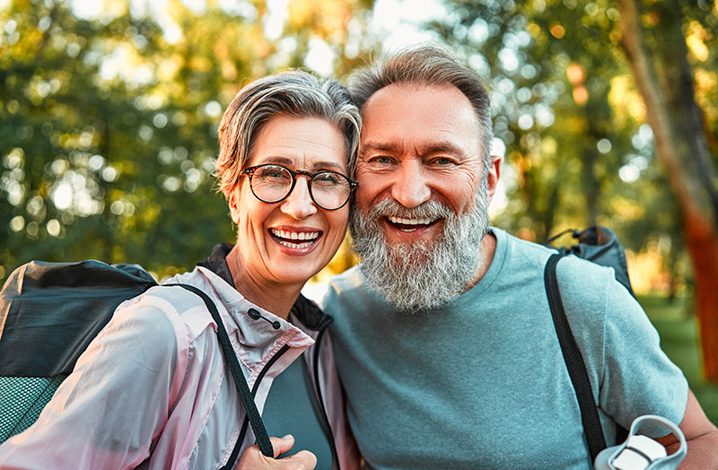 Active old age smiling couple