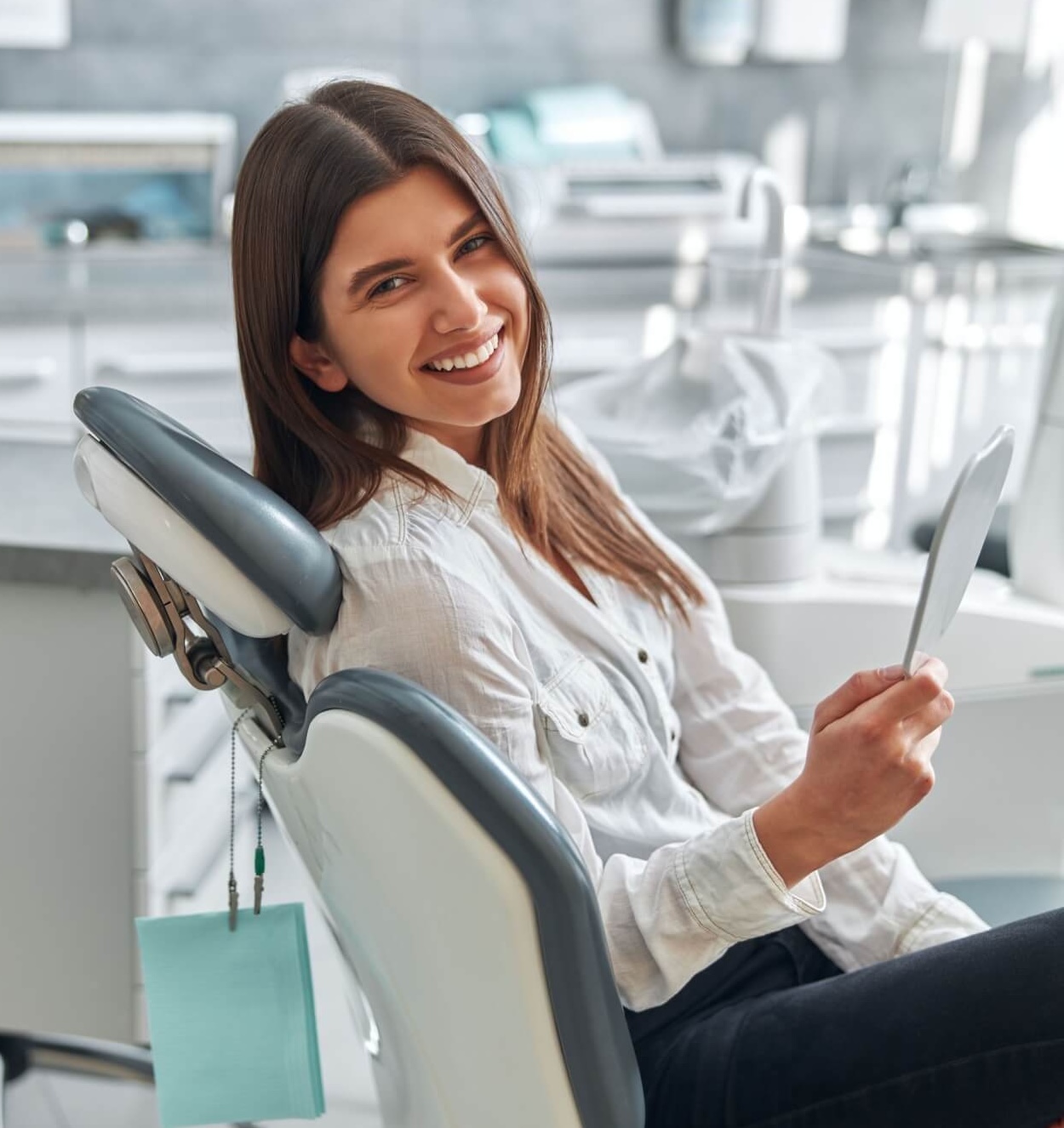 Happy young woman smiling checking out her perfect healthy teeth