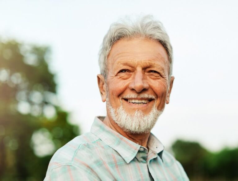 Happy senior man in park