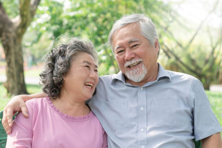 Healthy senior couple smiling with happiness