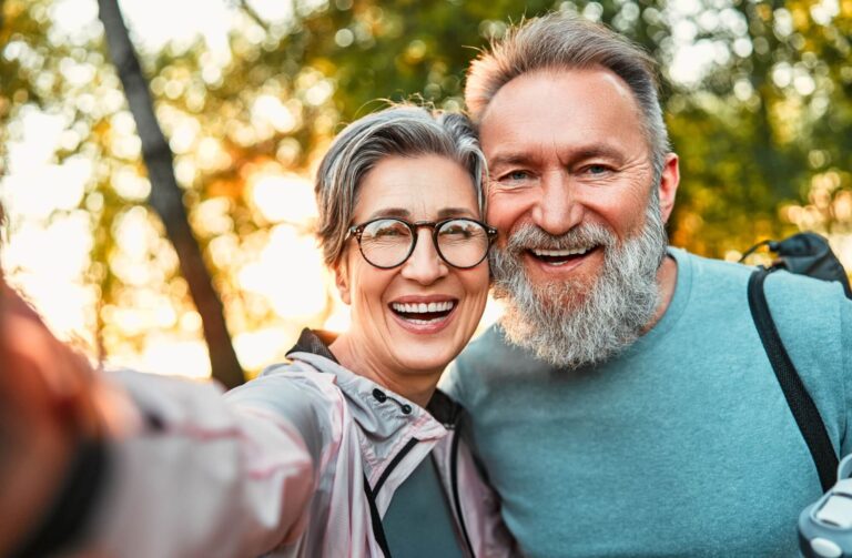 sincere cheerful mature couple smiling