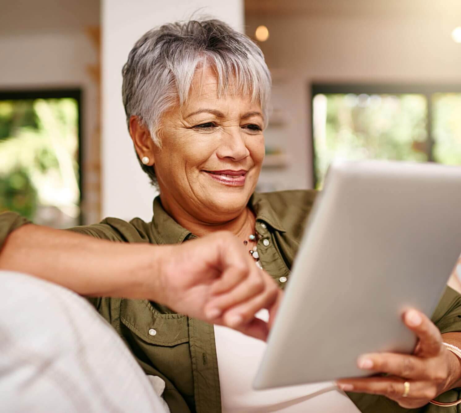 mature woman using tablet computer